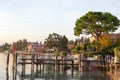 Old pier in Sirmione on Garda lake in a beautiful sunny day, Italy. Royalty Free Stock Photo