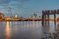 An old pier, the St Pauls cathedral, Blackfriars Bridge and the City of London Royalty Free Stock Photo