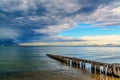 Old jetty dark clouds and ocean before the summer stormbefore the storm Royalty Free Stock Photo