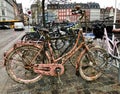 Old pink bike on the waterfront in Copenhagen on the background of colorful houses Royalty Free Stock Photo