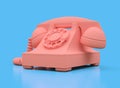 Old pink dial telephone on a blue background. 3d illustration Royalty Free Stock Photo