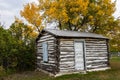 An old pioneer log cabin with fall colors Royalty Free Stock Photo