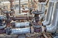 Old pipelines made of steel chromemolybdenum and valves on the s Royalty Free Stock Photo