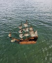 A Old Pirate ship with ruffled sails Royalty Free Stock Photo