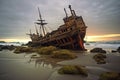 old pirate shipwreck washed ashore on a beach Royalty Free Stock Photo