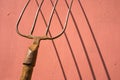 Old pitchfork with shadow Royalty Free Stock Photo