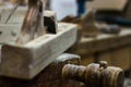 Old plane on a carpenter work bench Wood planer, Hand plane Royalty Free Stock Photo