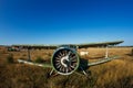 old plane stands in field propeller close-up Royalty Free Stock Photo