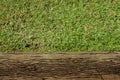 Old plank with grass texture background