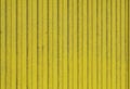 Old planks of wood painted bright yellow. Royalty Free Stock Photo