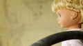 Old plastic doll with blonde hair. Royalty Free Stock Photo