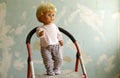 Old plastic doll with blonde hair. Royalty Free Stock Photo