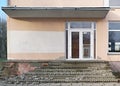 Old glass windows and doors  with destroyed stone staircase Royalty Free Stock Photo