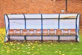 Old plastic seats on outdoor stadium players bench Royalty Free Stock Photo