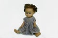 Old play doll with short hair hands down Royalty Free Stock Photo