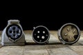 Old plug and socket high voltage. Old electrical accessories. Wooden table. Royalty Free Stock Photo