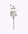 Old Plugging electrical white plug in electric socket isolated on white background. Royalty Free Stock Photo