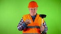 Old plumber with toilet plunger boast his lucrative job and doing thumbs up.