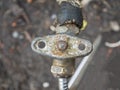 Old plumbing water tap with a metal valve Royalty Free Stock Photo