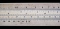 Old pocket slide rule mechanical calculator