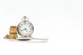 Old pocket watch , coin tower, time is money . Royalty Free Stock Photo