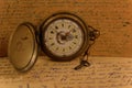 Old pocket watch with key Royalty Free Stock Photo