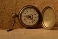 Old pocket watch with key Royalty Free Stock Photo