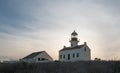 OLD POINT LOMA LIGHTHOUSE BACKLIT BY SUNSET AT POINT LOMA SAN DIEGO CALIFORNIA USA Royalty Free Stock Photo