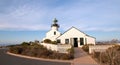 OLD POINT LOMA HISTORIC LIGHTHOUSE AT CABRILLO NATIONAL MONUMENT UNDER BLUE CIRRUS CLOUDS AT POINT LOMA SAN DIEGO CALIFORNIA USA Royalty Free Stock Photo