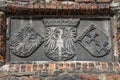 The old polish royal emblem, the emblem of the city Gdansk, Danzig. Stone.