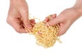 Old poor man eat with hands  long spaghetti pasta with fatty butter isolated macro Royalty Free Stock Photo