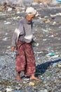 Old poor woman to Bali island. Indonesia Royalty Free Stock Photo