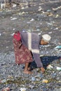 Old poor woman to Bali island. Indonesia Royalty Free Stock Photo