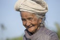 Old poor woman to Bali island. Indonesia Royalty Free Stock Photo