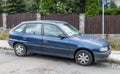 Old dark blue Opel Astra hatchback car parked