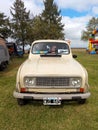 Old popular Renault 4 S short station wagon 1984. Classic economy car parked on the grass.