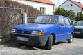 Old classic small veteran Italian popular blue Fiat Uno Fire 1.0 I.e.s parked Royalty Free Stock Photo