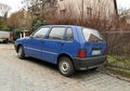 Old classic small veteran Italian popular blue Fiat Uno Fire 1.0 I.e.s parked Royalty Free Stock Photo