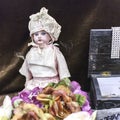 An old porcelain doll in a vintage market