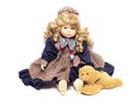 Old porcelain doll on White Background, ceramic dolls and a teddy bear. Royalty Free Stock Photo