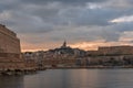 The Old Port and Basilica of Notre Dame de la Garde at dusk in Marseille, France Royalty Free Stock Photo