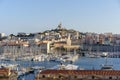 The Old Port and Basilica of Notre Dame de la Garde at dusk in Marseille, France Royalty Free Stock Photo