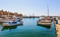 Old port of Chania town with parked yachts and fishing boats