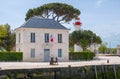 Old port office or Bureau du Port and lighthouse in historical harbor of La Rochelle, France Royalty Free Stock Photo