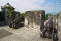 Old Portuguese cannons located on the exterior wall of the Guia Fortress in Macau, China. Royalty Free Stock Photo