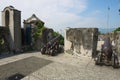 Old Portuguese cannons located on the exterior wall of the Guia Fortress in Macau, China. Royalty Free Stock Photo