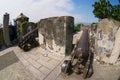 Old Portuguese cannons located on the exterior wall of the Guia Fortress in Macau, China. Royalty Free Stock Photo