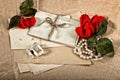 Old post cards, red rose flower, perfume and perls necklace Royalty Free Stock Photo