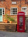 The Old Post Office, post box and red telephone box. Tillington, Sussex, UK.