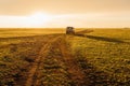 Old post soviet off-road vehicle car UAZ bus rides on a country road. Royalty Free Stock Photo